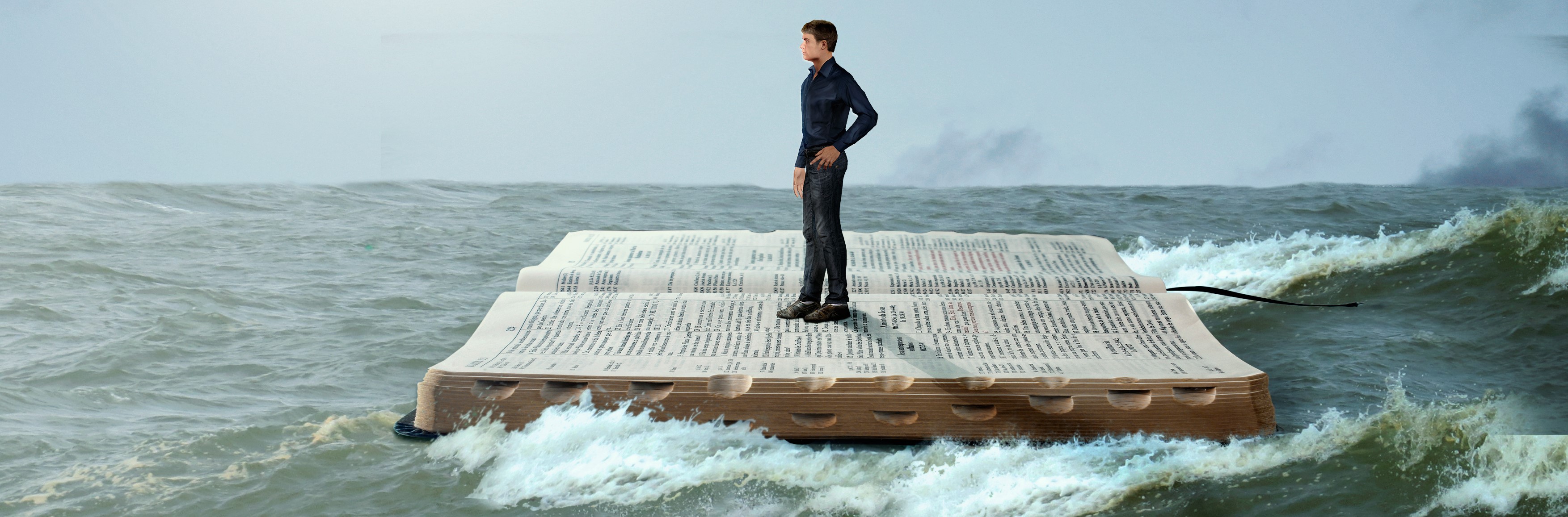 Man sailing on the Holy Bible in rough seas.